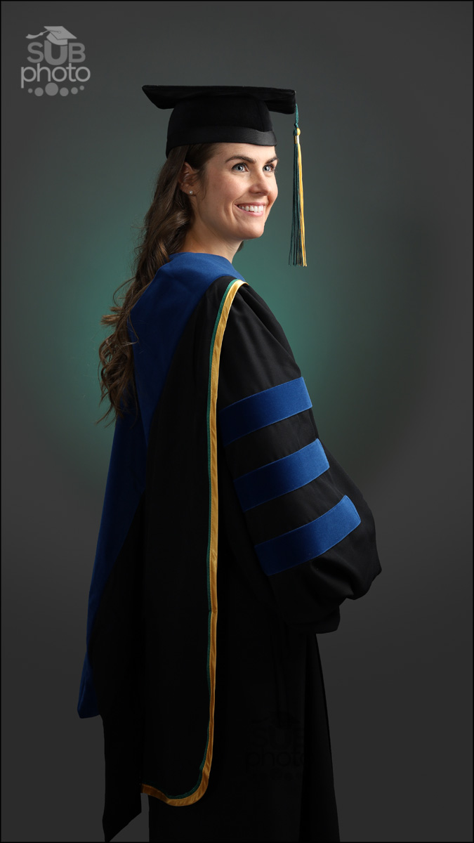 Woman wearing University of Alberta Doctorate cap and gown PhD