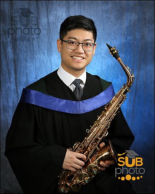 Grad with saxophone, classic collar and tie.